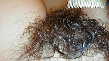 Extremely hairy bush fetish video: close-up of a hairy pussy underwater