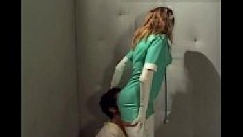 A gorgeous nurse wearing latex stockings and gloves